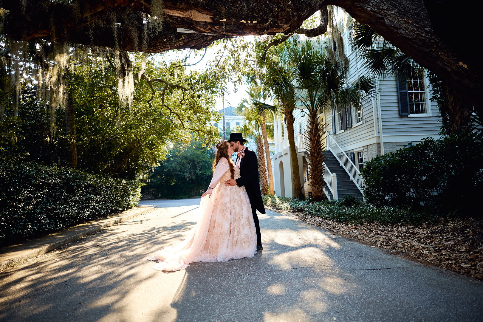  Bride and groom kiss during sunset golden hour on a Beaufort street. An update, as Luxe By Lindsay has moved to Charleston, SC and a call for unique, individual couples. 