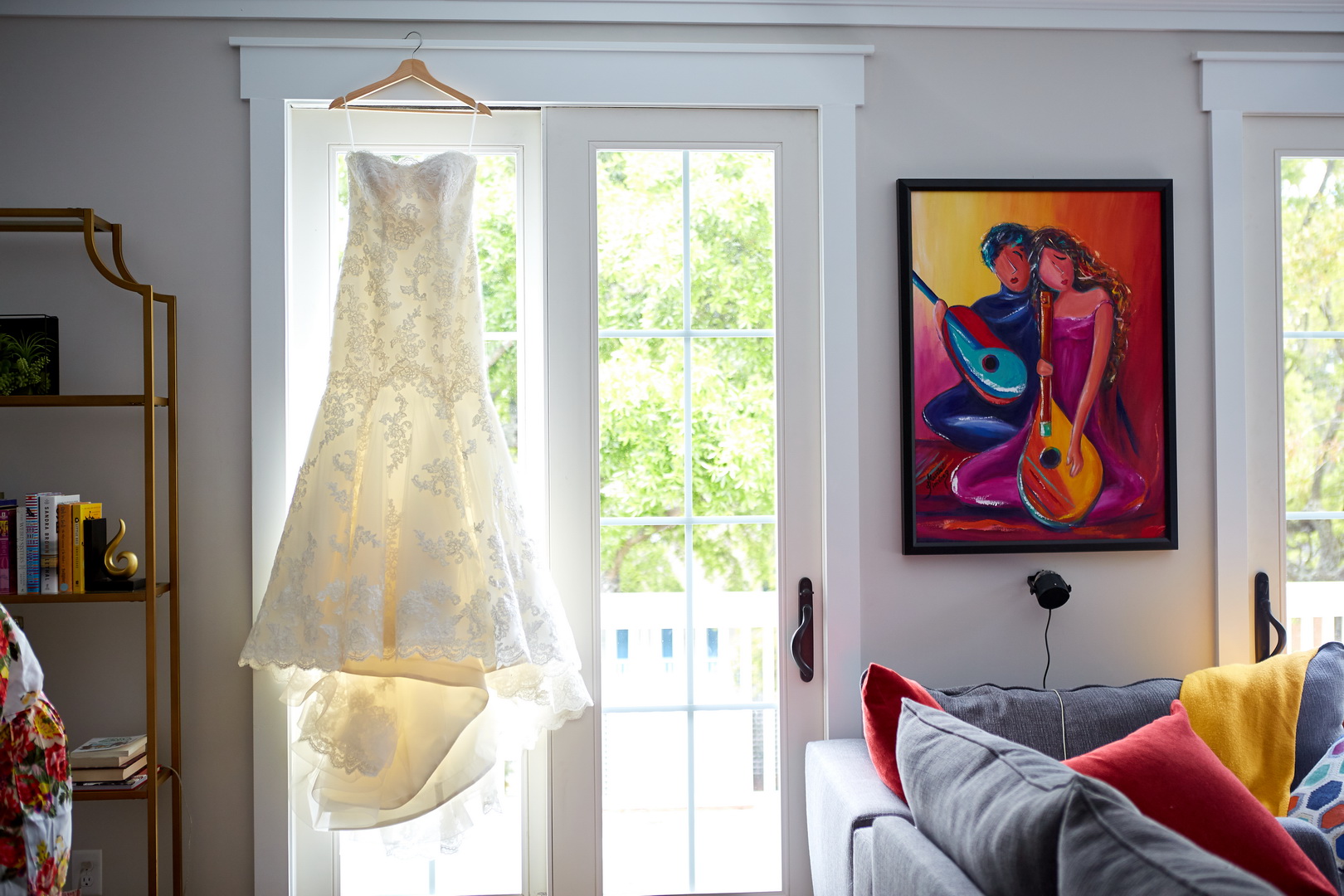 Wedding dress hanging in doorway in Isle of Palms, SC