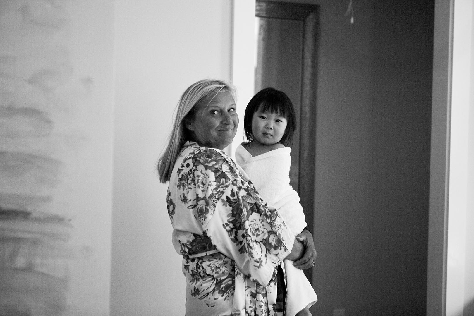 Candid portrait of mother of the groom and flower girl
