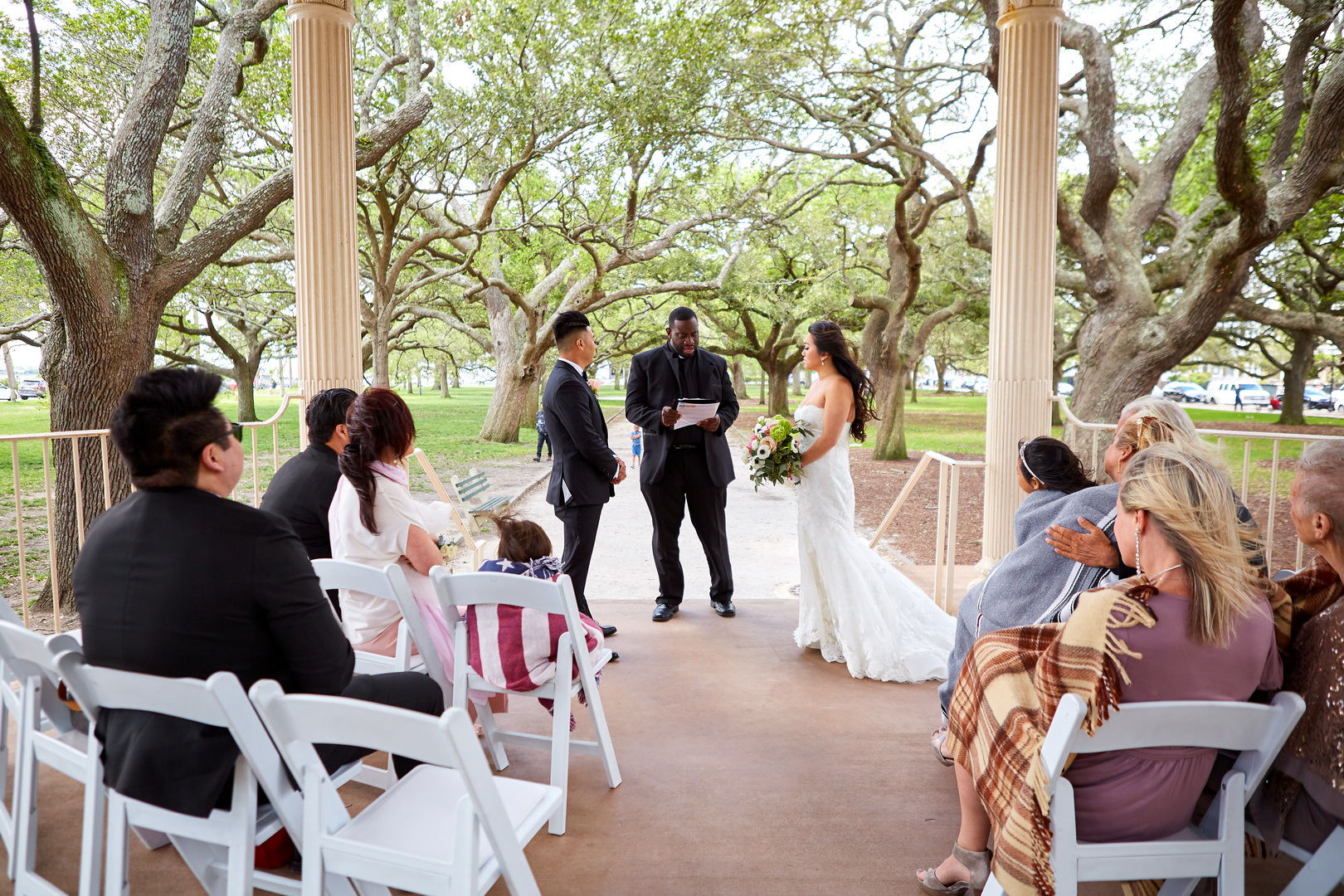 Intimate wedding ceremony in the Gazebo of White Point Garden, the Battery, Charleston, SC.