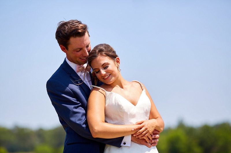 Groom holding bride at Charleston Woodlands