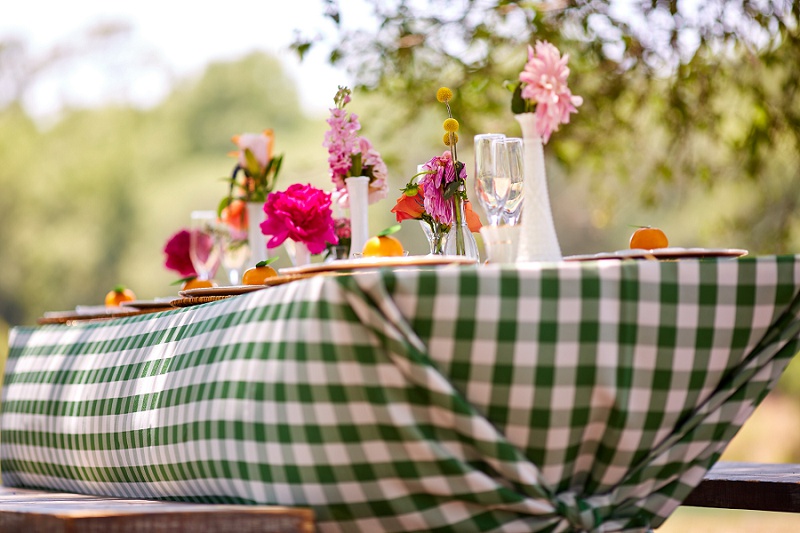 Detail of tablecloth olorful, gingham east coast reception table at Charleston Woodlands