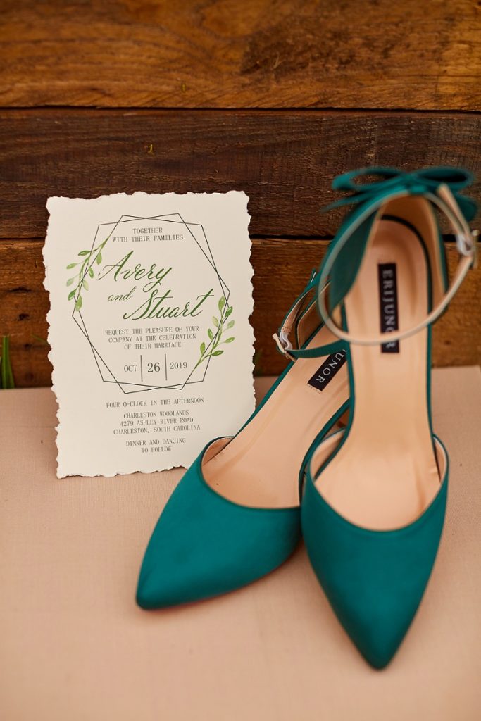 West Coast wedding invitation and green high heel shoes at Charleston Woodlands
