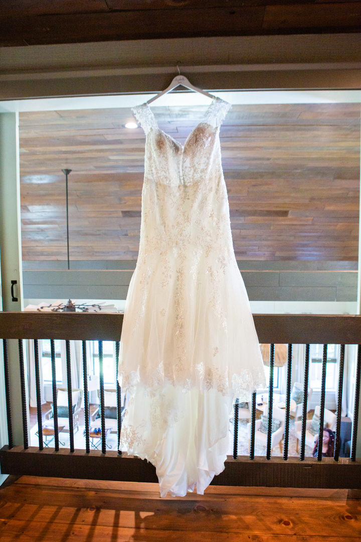 wedding dress hanging in the loft of the Edisto House at Eden at Gracefield - photographed by Charleston wedding photographer Luxe By Lindsay Photography