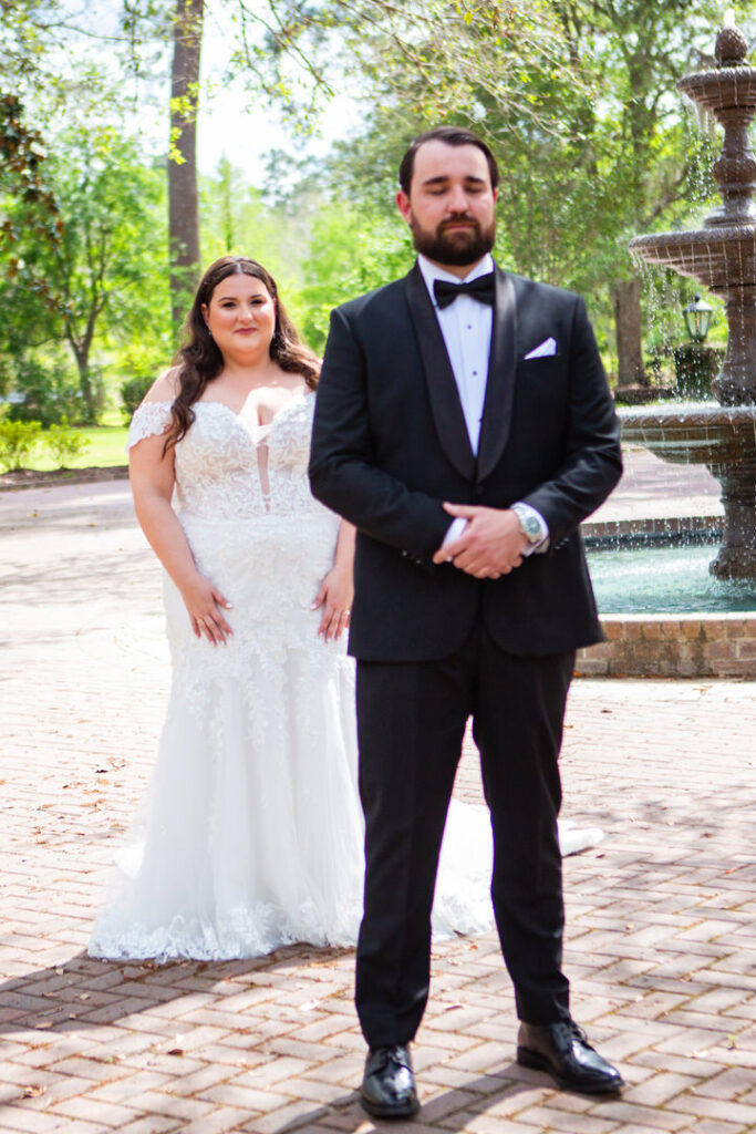 Bride walking up to groom for their first look at their Charleston wedding venue, Eden at Gracefield  - photographed by Charleston wedding photographer Luxe By Lindsay Photography