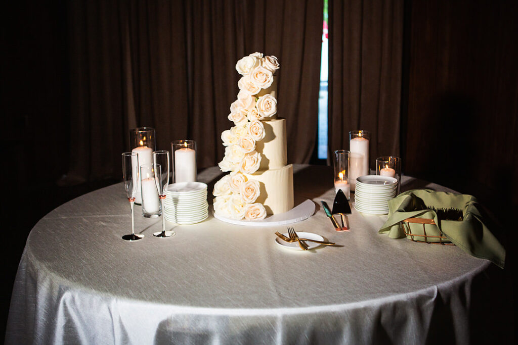 Beautiful 3 tiered wedding cake with white flowers - photographed by Charleston wedding photographer Luxe By Lindsay Photography